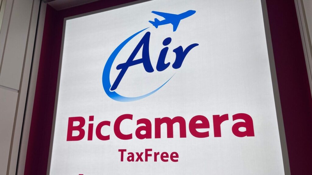 Bic Camera tax-free shopping sign at Japan airport with blue Air logo and airplane icon for international travelers