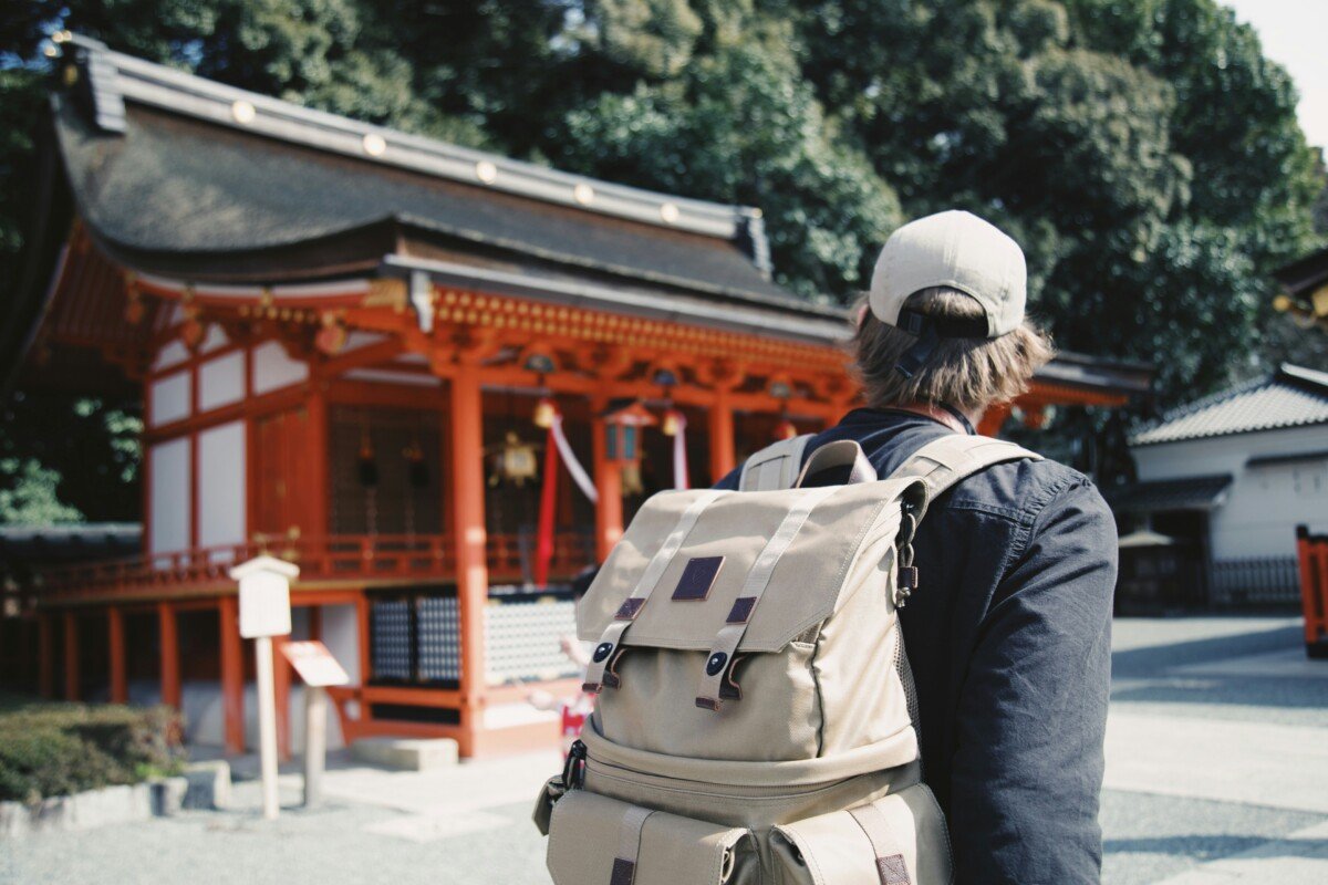 A tourist in Japan carrying a backpack.